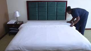 Housekeeping - Level 3 - Making the bed and dusting the guest room 2 of 3