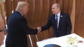 Donald Trump and Vladimir Putin shake hands for the first time