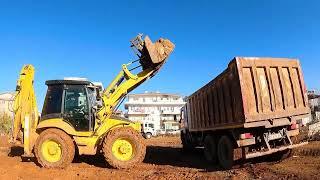 Bucket videos Construction Equipment videos Hidromek102s backhoe loader Loading a truck in light mud