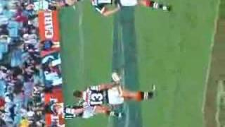 craig fitzgibbon kicking a goal round 21 vs cowboys 2006