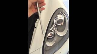 How to take off the headlamp on a 2014 Porsche Cayenne