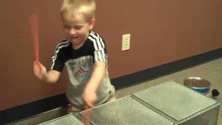 Fun At The Office - Connor Playing Drums (well actually playing the filing baskets)