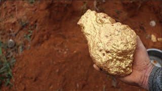 Australian gold prospectors use mining tools to unearth large gold nuggets worth millions