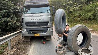 Rescue journey to repair a flat tire on a heavy-duty dump truck on a mountain pass