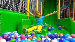 Yaroslava plays in the Indoor Kids Center - Climbing, Spinning and Creative Building Video for kids