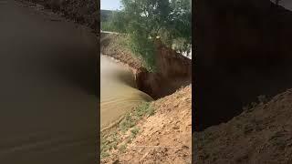 Process Of Heavy Rain Water Scouring The Soil Which Is Loose, Porous And Has Vertical Fissures !