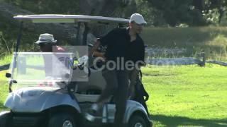 FILE:OBAMA PLAYS GOLF WITH TIGER WOODS