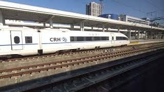 Modern and Futuristic 350kmh Chinese High Speed Train arriving at the station in China!