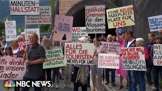 Residents of beautiful Austrian town block tunnel in protest over tourism