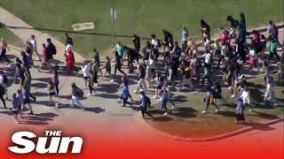 Aerial video shows students staging walkout to protest shooting of Black teen