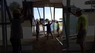 Losberger structure - Installing 4m glass wall panels