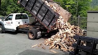 Satisfying- Truck carefully unloads firewood