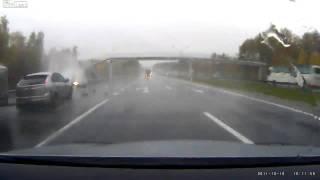 Aquaplaning and unexpected impact of the car on a wet highway