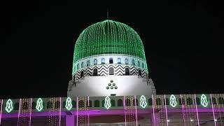 A Faizan e Madina Mosque and street is seen as it is illuminated with colorful decoration lights for