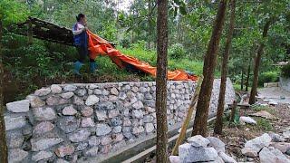 Build an embankment with stone and cement. Share planks of 2 oval trees that fell due to the storm