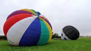 Homemade balloons launch side by side