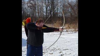 Longbow trick shooting-half dollars on the wing.(Howard Hill Style)