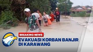 BREAKING NEWS - Petugas BPBD Karawang Evakuasi Korban Banjir