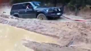 big fail. land cruiser has to be dragged out for bog hole by discovery