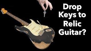 Dropping Keys on a Guitar to Relic It