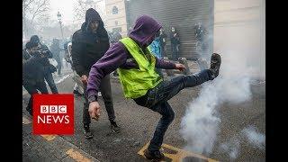 Yellow vest movement: Paris police fire tear gas at protesters - BBC News