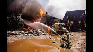 Jacksonville Fire Rescue Department fights vehicle fire that catches commercial structure