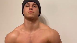 Handsome muscular guy showing off his muscle