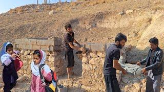 "The amazing help of the cameraman to Javad and the orphan girls; building a house with blocks"