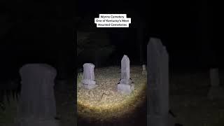 paranormal activity with a spirit box at a cemetery.