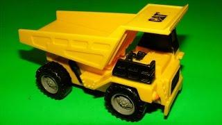 Trucks for children: toy construction trucks collection and rainbow rice sensory box