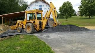 Installing Gravel driveway with John Deere 310A Backhoe