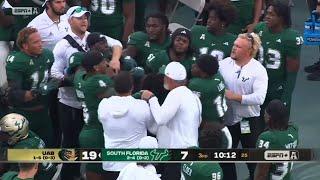 USF players fight each other on the sideline 