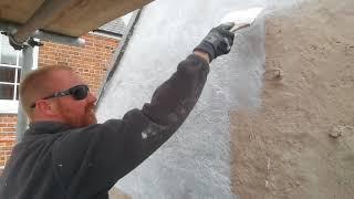 Dan applying limewash to lime mortar to stop rain penetration to this 1770s listed building.