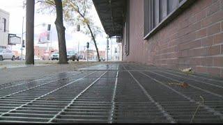 Man crawls under sidewalk in downtown Spokane, causes short power outage