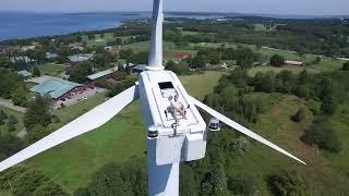 Drone Captures Man Sunbathing on Wind Turbine