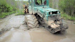 Forestry tractor logging in water and mud