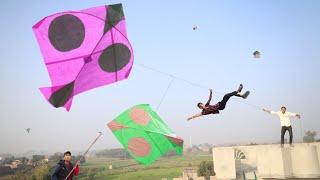 Big Kite Flying With Small Kite Catch