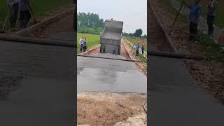 Concrete pouring process from the truck for rural pavement