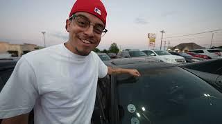 Ralph Barbosa reviews cars at car meet