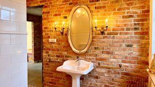 Chandelier in the bathroom. White Italian retro fittings and wooden accessories. Vlog