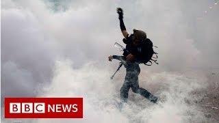 China warns Hong Kong protesters not to 'play with fire' - BBC News