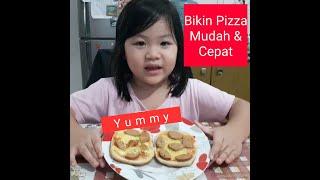 Laura membuat pizza