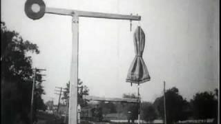 Train taking up mail bag, U.S. Post Office