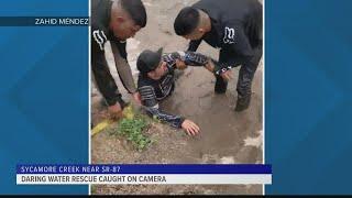 Caught on Camera: Good Samaritans rescue family from rushing Arizona floodwaters