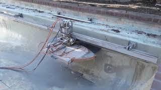 Cutting a swimming pool in half! Fast Forward Concrete Cutting!