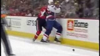 Chris Neil destroys Niklas Backstrom