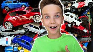 Mark walks around and unpacks new cars of different brands