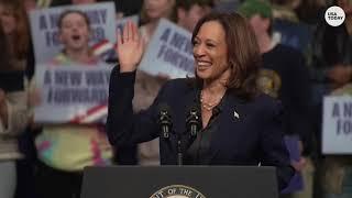 Harris points hecklers to smaller Trump rally nearby | USA TODAY