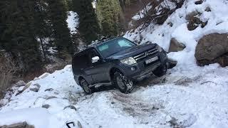 Pajero 4 on snow rocks