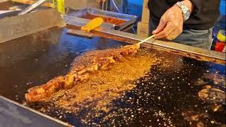 铁板鱿鱼、长春南湖的街头小吃，Sizzling squid, street food in Nanhu, Changchun, China